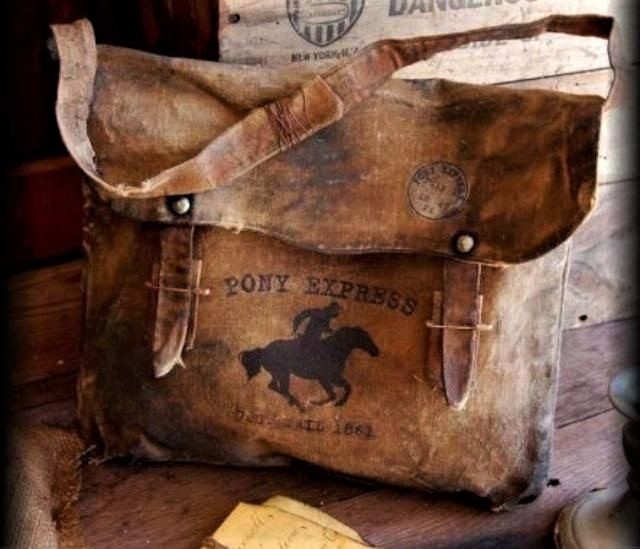 Image of an old leather bag that would carry mail, rustic feeling